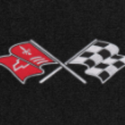 C3 Corvette Crossed Flags logo on black Lloyd carpet - close-up