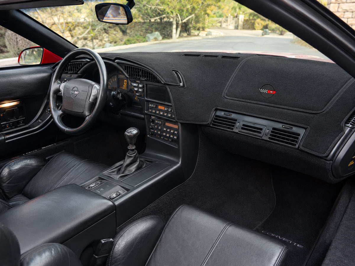 C4 Corvette Coverking custom dash cover with embroidered C4 crossed flags emblem