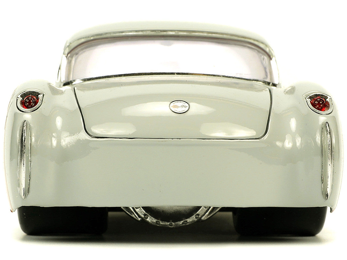 1957-chevrolet-corvette-beige-with-pink-interior-with-bugs-bunny-figure-looney-tunes-hollywood-rides-series-1-24-diecast-model-car-by-jada